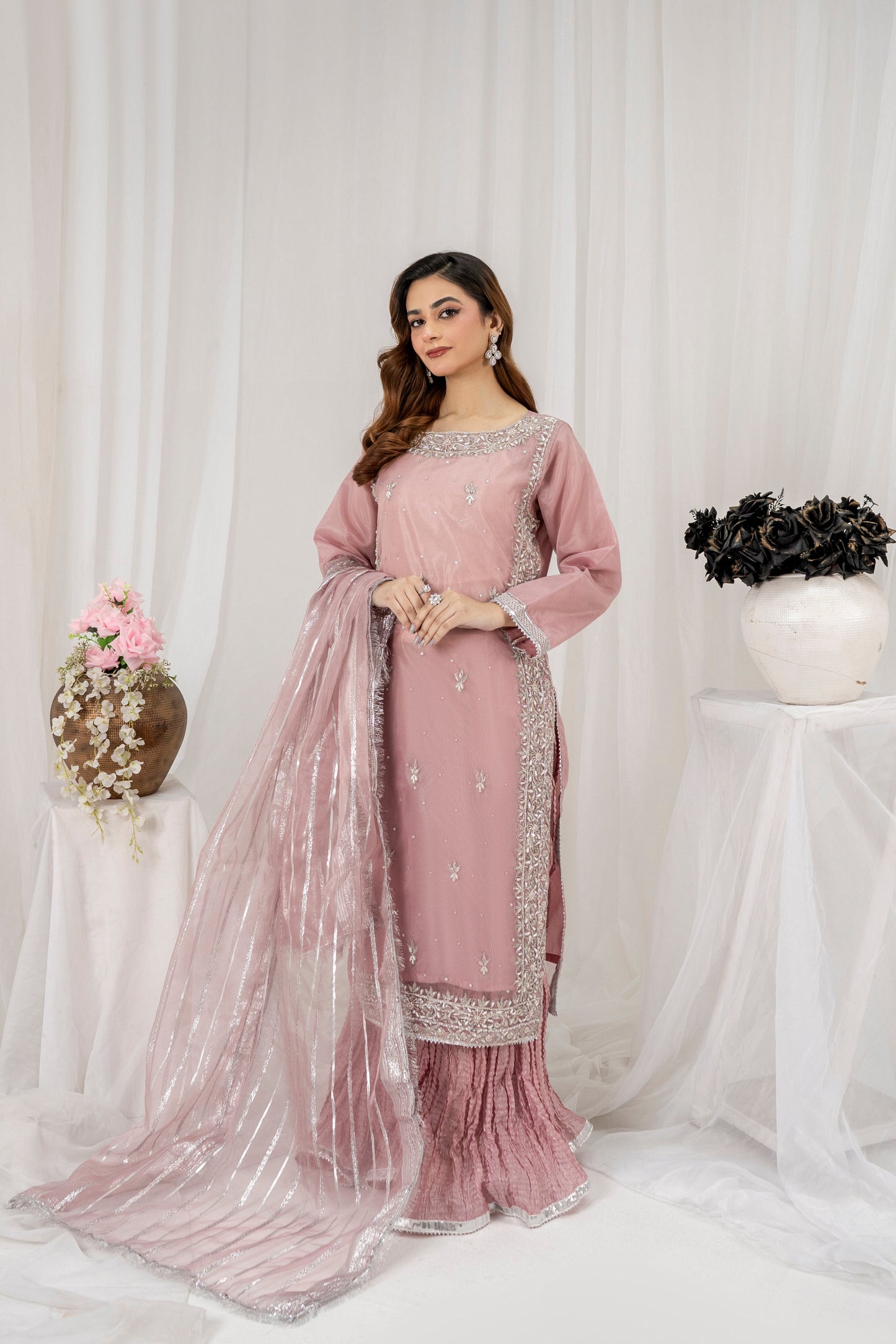 Elegant mauve pink 3-piece organza sharara set featuring intricate embroidery, a Kattan silk sharara, and a delicately adorned organza dupatta – perfect for wedding guests, festive occasions, and formal wear.